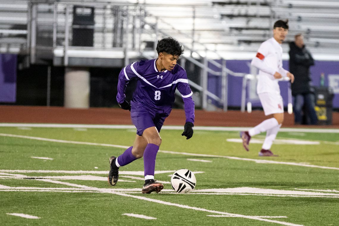 Guillermo Hernandez prepares to launch a pass downfield during Friday night’s game versus East View. Photo by Erin Anderson