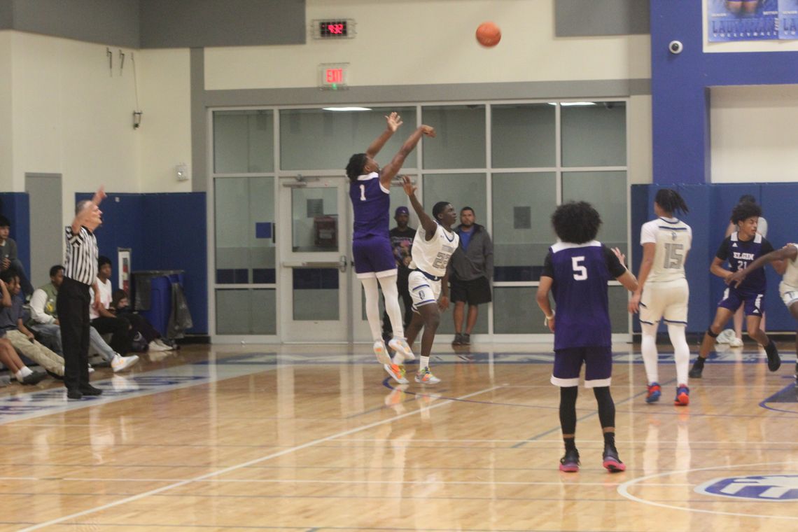 Elgin High School boys varsity basketball senior guard Nathen Lewis (1) knocks down a three-pointer Friday, Dec. 15 during the Wildcats’ 50-44 road victory at Manor New Tech High School. Photo by Andrew Salmi