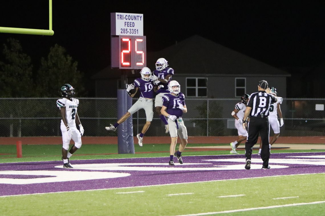 Elgin High School varsity football senior wide receiver Blake Courtney (19) celebrates with sophomore wide receiver Gary Jefferson Jr. (14) and junior wide receiver Blake Thames (15) following a touchdown on Sept. 22 during the Wildcats’ 50-28 victory at home vs. Pflugerville Connally High...