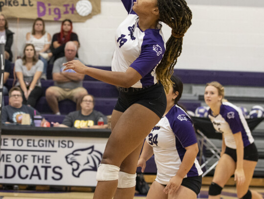 Josephine Jackson goes airborne as she prepares to hammer down a big-time spike. Photo by Erin Anderson