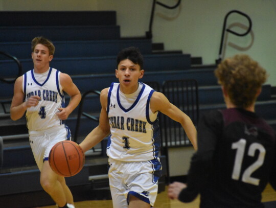 Eagles point guard Robert Conrad leading a fast-paced offensive attack against Lockhart. Conrad emerged as a top-notch player during the 2021-22 season and has taken another step forward this year. Photo by Quinn Donoghue