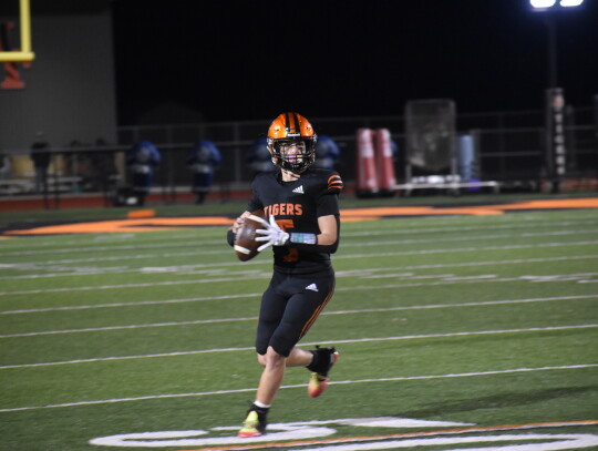 Smithville’s Tyson Hancock showcases his offensive versatility as he’s relieved of his wide receiver duties to fill in for an injured Derrick Roberson at quarterback. Photo by Quinn Donoghue