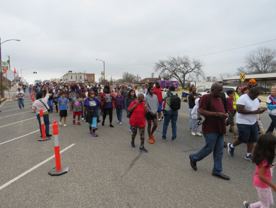 Residents march through Elgin Jan. 16 for the 34th Annual Walk for Peace, Justice, and Equality to celebrate Martin Luther King Jr. Day. Photo by Fernando Castro