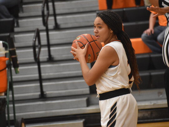 Monica Lewis surveys the defense before making an inbound pass. Photo by Quinn Donoghue