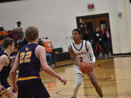 Ramon Adams prepares for a step-back 3-pointer in the fourth quarter against La Grange. Photo by Quinn Donoghue