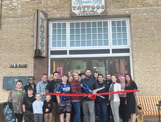 The Elgin Chamber of Commerce and downtown Elgin’s Remember Me Tattoos celebrate their renovated shop with a ribbon cutting ceremony. Photo courtesy of Veronica Seever