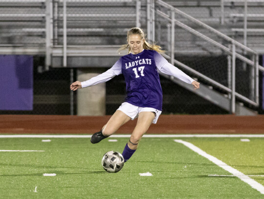 Courtney Shepard delivers an open-field pass to one of her teammates. Photo by Erin Anderson