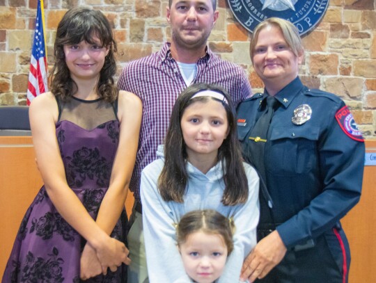 Vicky Steffanic (right) celebrates with her family after being named chief of police during the Bastrop City Council meeting April 11. Also pictured are her husband, Matthew Steffanic; and daughters, Ryan, Kinsey and Olivia Steffanic. Courtesy photo / City of Bastrop