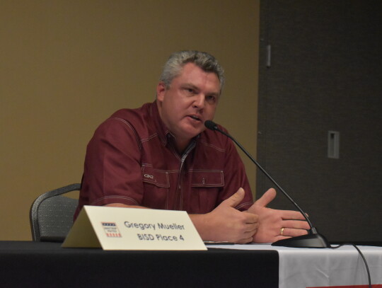 Greg Mueller gives his opening remarks at the Bastrop ISD candidate forum held at the Bastrop Chamber of Commerce in Bastrop April 11. Photo by Fernando Castro