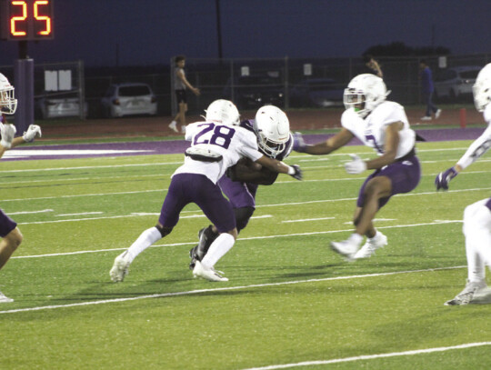 Elgin junior cornerback Marcus Hickman (28) makes an open-field tackle on Friday, May 19 during the annual spring scrimmage held at Wildcat Stadium. Photo by Andrew Salmi