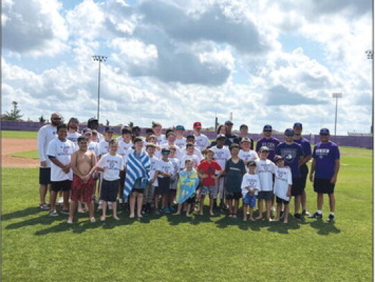 Elgin Wildcats campers from first through ninth grade happily gather together following the conclusion of baseball camp on Thursday, June 1 at the high school baseball field. Photos courtesy of Elgin ISD