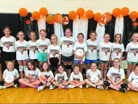 Smithville girls in first through fifth grade gather around during the Lady Tigers Volleyball Camp in the high school gym. Photo courtesy of Smithville Lady Tiger Athletics