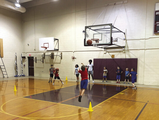 Campers improve their shooting ability with a drill on June 22 during the Bastrop Bears boys youth basketball camp in Bastrop. Photo courtesy of Eric Woods