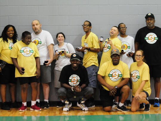 The Shining Stars team, the special needs group, poses for a photo on July 10, 2022, with Taylor Press area editor Jason Hennington. Photo by Jason Hennington