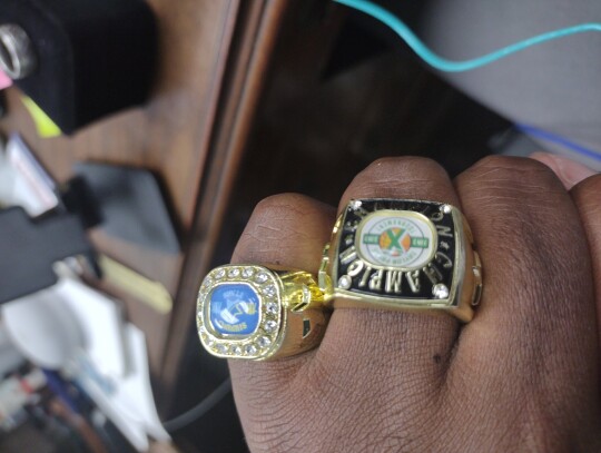 Jason Hennington displays the 2023 Taylor Press 3-on-3 Basketball Tournament rings that will be awarded to the top age groups and Shining Stars. Photo by Jason Hennington