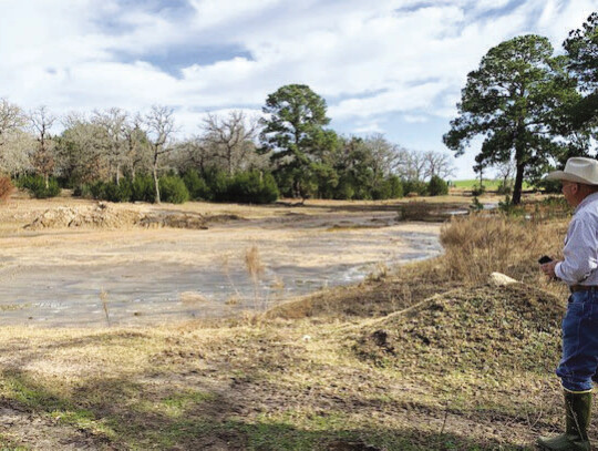 A large stock tank, completely filled with silt during last summer’s drought. Photo by Diann Watson