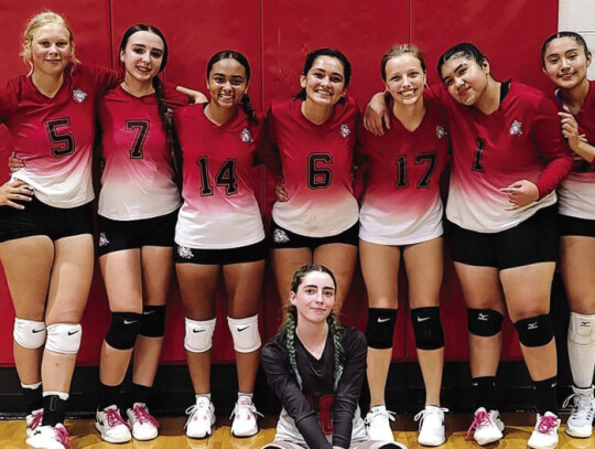 The McDade High School varsity volleyball team proudly poses together on Tuesday, Aug. 8 after defeating Snook High School in the team’s regular-season opener. Photo courtesy of Aaron Hallford