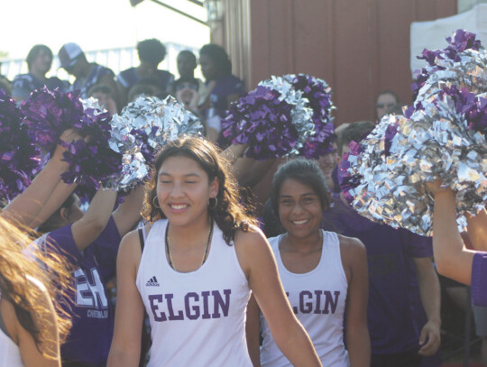 Elgin girls varsity cross country runners are introduced on Aug. 10 during the annual Meet The Wildcats event held at Veterans’ Memorial Park. Photo by Andrew Salmi