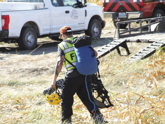 Responders resorted to using ropes to lower in David Newman of the Bastrop County Sheriff’s Office. Photo by Hunter Dworaczyk