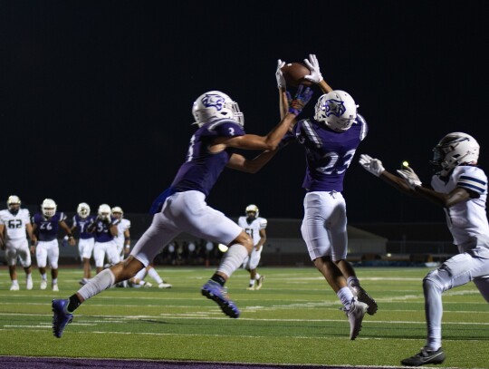 Wildcats varsity football senior defensive back Jaydan Alvizo (23) and junior Noddyn Bailey (3) break up a pass on Friday night during Elgin’s 47-0 home victory against Austin Akins. Photo by Marcial Guajardo 