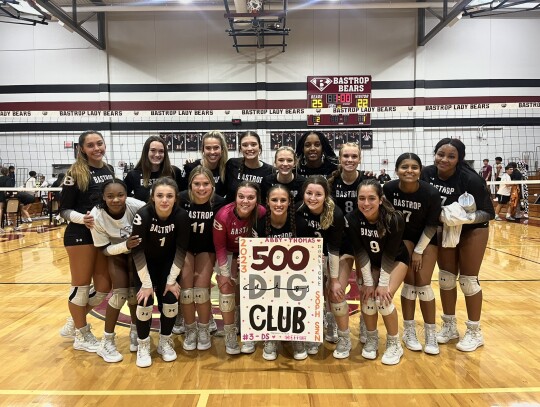 Lady Bears varsity volleyball sophomore Abby Thomas and her teammates celebrate with a photo on Sept. 19 to congratulate her on 500 career digs, which she achieved during Bastrop’s home match win vs. Pflugerville Connally High School. Photo courtesy of Morgan Rollins