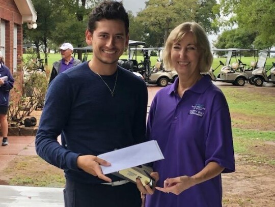 Carlos Tercero of Covert Hutto poses with Ruth Hyatt after his team placed first in the Relay For Life of Elgin Golf Tournament. Photo courtesy of Ruth Hyatt