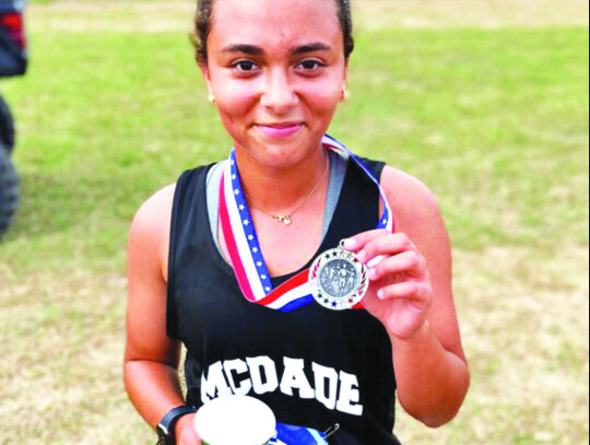 McDade High School girls varsity cross country sophomore runner Summer Jacobs poses after placing second Oct. 12 at the 1A-District 29 meet hosted by Fayetteville High School. Photo courtesy of McDade ISD