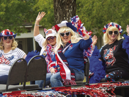 Locals geared up in their ride, white and blue for the celebratory day.