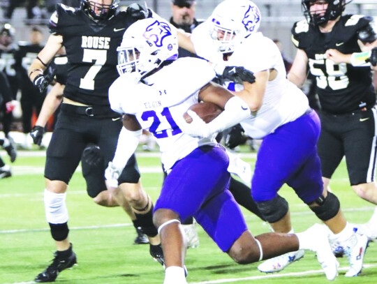 Elgin High School varsity football senior running back Darren Harper gets outside and runs for extra yardage Nov. 2 during the Wildcats’ road game against Leander Rouse High School. Photo by Zoe Grames