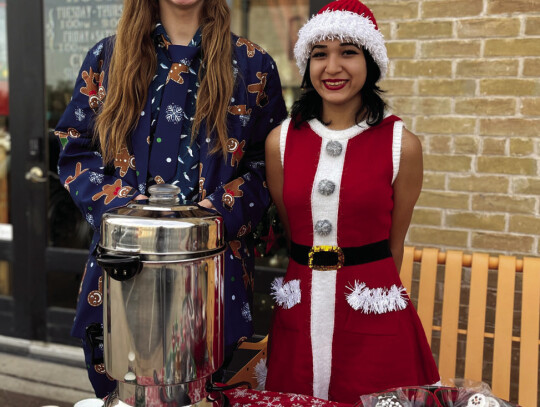 Hadyn Carnus and Elyse Olvera manning Remember Me Tattoos’ hot cocoa station.