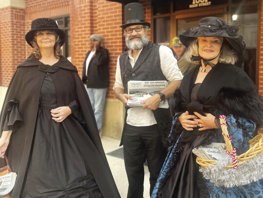 Theresa Schader, Steven Schader and Kathy Hrna traditionally dressed in support of Smithville’s “Dickens on Main Street” event, more seasonal fun set for Dec. 15 and 16. Photo by Niko Demetriou