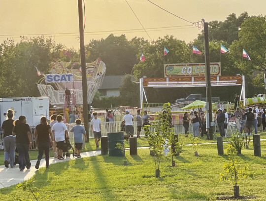 As the sun lowered and temperatures dropped, the carnival grounds began to pick up. Photo by Niko Demetriou