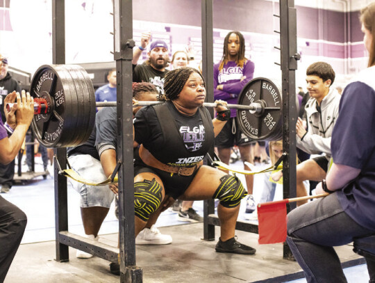 Elgin High School girls varsity powerlifting senior Nya Kirk Jones competes in the squat Saturday, Jan. 27 during the Wildcat Invitational meet held in Elgin. Photo by Erin Anderson