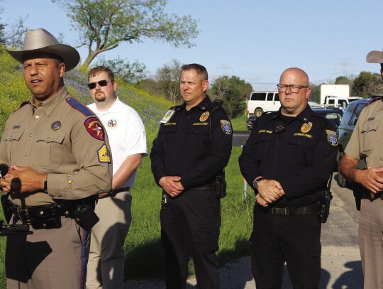 Sgt. Deon Cockrell, Texas Department of Public Safety, provides an update after the fatal collision between a Hays Consolidated Independent School District bus and a concrete truck. Photo by Jason Hennington